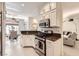 Stylish kitchen with stainless steel appliances, white cabinets, and granite countertops, perfect for cooking and entertaining at 2050 W Warm Springs Rd # 3624, Henderson, NV 89014