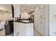 Bright kitchen featuring white cabinets, stainless steel appliances, and dark countertops at 2050 W Warm Springs Rd # 3624, Henderson, NV 89014