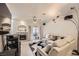 Cozy living room featuring a decorative fireplace, plush seating, and a ceiling fan at 2050 W Warm Springs Rd # 3624, Henderson, NV 89014