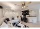 Spacious living area with a large TV, stylish lighting, and comfortable seating arrangements at 2050 W Warm Springs Rd # 3624, Henderson, NV 89014