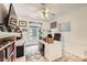 Well-lit home office with a large desk, built-in shelving, and a comfortable leather chair at 2050 W Warm Springs Rd # 3624, Henderson, NV 89014