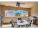 Comfortable patio area with a ceiling fan, dining set, and a view of the community at 2050 W Warm Springs Rd # 3624, Henderson, NV 89014