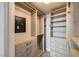 Organized walk-in closet with custom shelving, drawers, and secure safe for valuables at 222 Karen Ave # 2305, Las Vegas, NV 89109