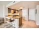 Well-lit kitchen features granite countertops, stainless steel appliances, and bar stool seating at 222 Karen Ave # 2305, Las Vegas, NV 89109