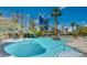 Enjoy the large swimming pool with tropical landscaping and city views in the background at 222 Karen Ave # 2305, Las Vegas, NV 89109