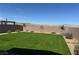 Spacious backyard featuring a well-maintained turf lawn and mountain views at 2645 Cava Tirreni St, Henderson, NV 89044