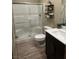 Modern bathroom features a glass-enclosed shower, sleek vanity, and stylish shelving at 2645 Cava Tirreni St, Henderson, NV 89044