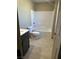 Bright bathroom featuring a shower-tub combination and neutral-toned tile flooring at 2645 Cava Tirreni St, Henderson, NV 89044