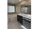 Bathroom features a soaking tub, double vanity, and modern fixtures at 2645 Cava Tirreni St, Henderson, NV 89044