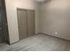 Cozy bedroom with neutral carpet and sliding closet doors, offering a serene space at 2645 Cava Tirreni St, Henderson, NV 89044