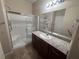Bathroom featuring glass shower, granite countertop, and sink with faucet at 2653 Crystal Blue St, Laughlin, NV 89029