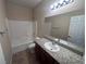 Well-lit bathroom featuring granite countertop and a shower-tub combo at 2653 Crystal Blue St, Laughlin, NV 89029