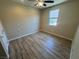 Bedroom featuring modern ceiling fan and plank flooring and window at 2653 Crystal Blue St, Laughlin, NV 89029