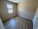 Bedroom featuring a window and plank flooring at 2653 Crystal Blue St, Laughlin, NV 89029