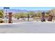 Community entrance gates with mature landscaping and mountain views at 2653 Crystal Blue St, Laughlin, NV 89029