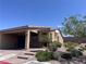 Inviting home showcasing desert landscaping, a two-car garage, and brick-paved driveway at 2653 Crystal Blue St, Laughlin, NV 89029