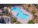 Resort-style community pool with palm trees and a gated fence for added security at 2653 Crystal Blue St, Laughlin, NV 89029