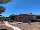 Exterior view of a cozy, well-maintained single-story home with desert landscaping at 2657 Kline Cir, Las Vegas, NV 89121