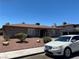A well-maintained single-story home with desert landscaping, driveway, and parked car at 2657 Kline Cir, Las Vegas, NV 89121