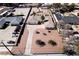 Aerial view of a property featuring a long driveway, desert landscaping, and mature trees at 2755 E Russell Rd, Las Vegas, NV 89120
