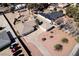 Aerial view of a home with a large driveway, mature palm trees, and desert landscaping at 2755 E Russell Rd, Las Vegas, NV 89120