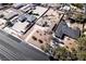 A bird's-eye view reveals a home with desert landscaping and an ample driveway with plenty of parking at 2755 E Russell Rd, Las Vegas, NV 89120