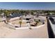 Scenic aerial view of the house with palm trees and desert landscape at 2755 E Russell Rd, Las Vegas, NV 89120