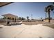 The backyard features desert landscaping and a covered pergola at 2755 E Russell Rd, Las Vegas, NV 89120