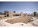 View of the home's backyard showcasing the patio, walkway, and dirt landscaping at 2755 E Russell Rd, Las Vegas, NV 89120