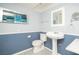 Traditional bathroom features a pedestal sink and updated fixtures at 2755 E Russell Rd, Las Vegas, NV 89120