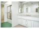 Well-lit bathroom with a shower and marble countertops at 2755 E Russell Rd, Las Vegas, NV 89120