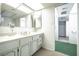Bathroom featuring marble countertops and a decorative mirror at 2755 E Russell Rd, Las Vegas, NV 89120
