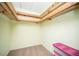 Walk-in closet with carpeted flooring and a partially exposed ceiling structure at 2755 E Russell Rd, Las Vegas, NV 89120