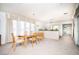 Bright dining room features a wooden table, 6 chairs, chandelier, and large window at 2755 E Russell Rd, Las Vegas, NV 89120