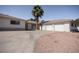 Front exterior showcasing a well-maintained home with a spacious driveway at 2755 E Russell Rd, Las Vegas, NV 89120