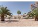 Charming single-story home featuring desert landscaping and mature palm trees in a quiet residential area at 2755 E Russell Rd, Las Vegas, NV 89120