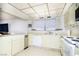 Traditional kitchen featuring a window and cream-colored cabinets at 2755 E Russell Rd, Las Vegas, NV 89120