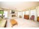 Bright living area with brick fireplace, large windows and vintage decor at 2755 E Russell Rd, Las Vegas, NV 89120