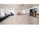 Large living area with stone fireplace, natural light, and ample space for furniture at 2755 E Russell Rd, Las Vegas, NV 89120