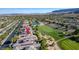 Aerial view of the home showcasing its location in a vibrant community with golf course and water features at 2797 Turtle Head Peak Dr, Las Vegas, NV 89135