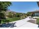 Spacious, landscaped backyard offers ample lounging space with scenic views of the surrounding community at 2797 Turtle Head Peak Dr, Las Vegas, NV 89135