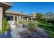 Beautiful backyard featuring lush landscaping, patio furniture and a relaxing outdoor living space at 2797 Turtle Head Peak Dr, Las Vegas, NV 89135