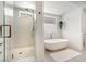 Sleek, modern bathroom with a soaking tub, and walk-in shower at 2797 Turtle Head Peak Dr, Las Vegas, NV 89135