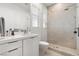 Modern bathroom featuring a sleek vanity, a glass-enclosed shower, and contemporary fixtures at 2797 Turtle Head Peak Dr, Las Vegas, NV 89135