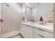 This well-lit bathroom features a glass shower, modern fixtures, and ample counter space at 2797 Turtle Head Peak Dr, Las Vegas, NV 89135