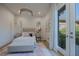 Charming bedroom with a cozy bed, decorative rug, and a large window providing natural light and views at 2797 Turtle Head Peak Dr, Las Vegas, NV 89135