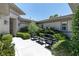 Charming courtyard with seating, manicured landscaping, and elegant outdoor lighting fixtures at 2797 Turtle Head Peak Dr, Las Vegas, NV 89135
