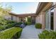Inviting courtyard with stylish outdoor seating, lush greenery, and well-defined concrete pavers at 2797 Turtle Head Peak Dr, Las Vegas, NV 89135