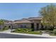 Attractive, single-story home with a 3-car garage, beautiful stone accents, and lush landscaping at 2797 Turtle Head Peak Dr, Las Vegas, NV 89135