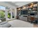 A dedicated home office with built-in shelving, desk space, and bright natural light at 2797 Turtle Head Peak Dr, Las Vegas, NV 89135
